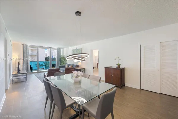 a view of a dining room with furniture and wooden floor