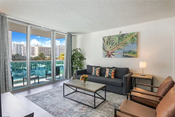 a living room with furniture and a large window