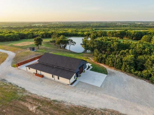 4251 Refuge Road Sherman, TX 75092 - Photo 4 of 40 an aerial view of a city with ocean view