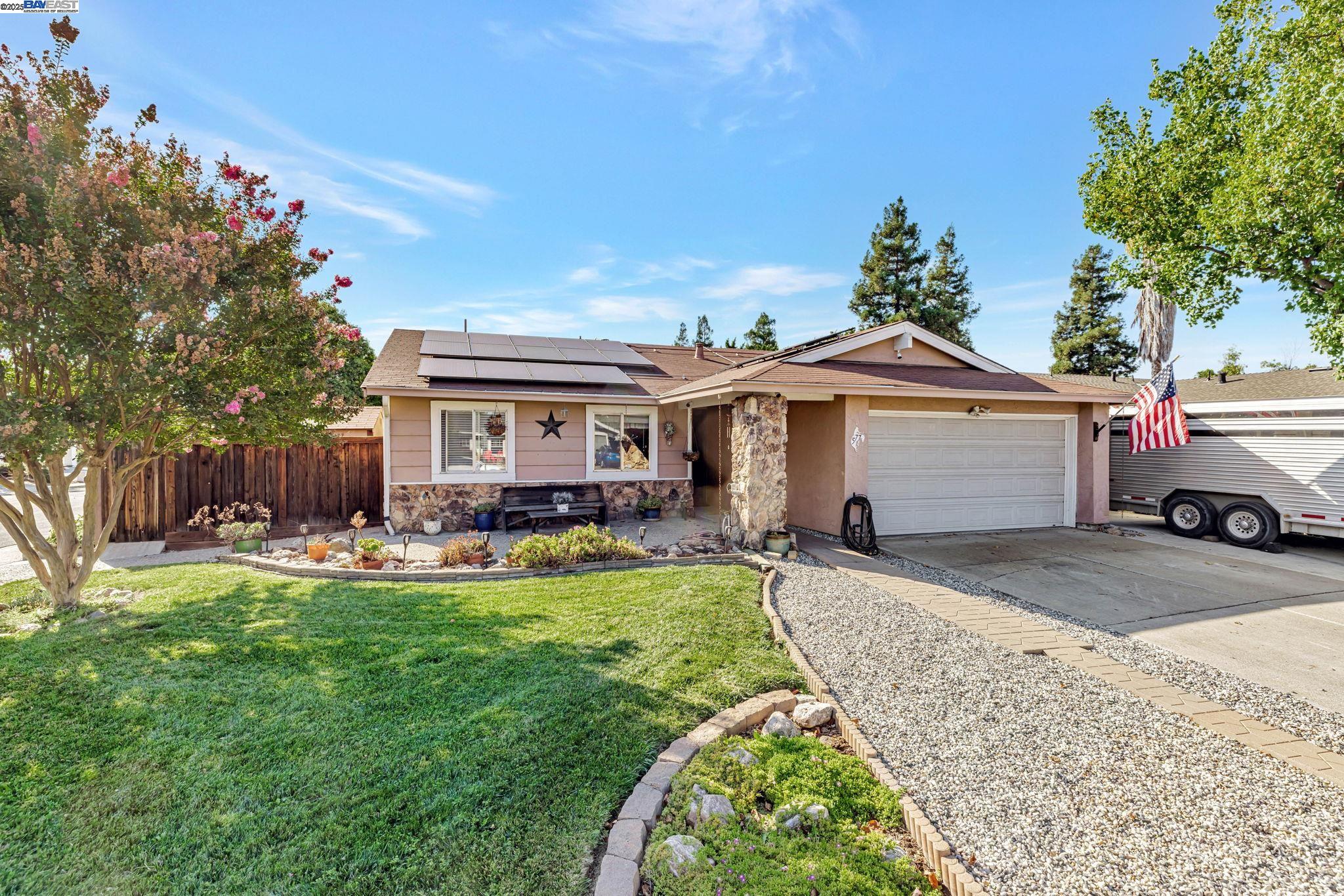 577 Rachelle Street Livermore, CA 94550 - Photo 1 of 1 a front view of a house with swimming pool having outdoor seating