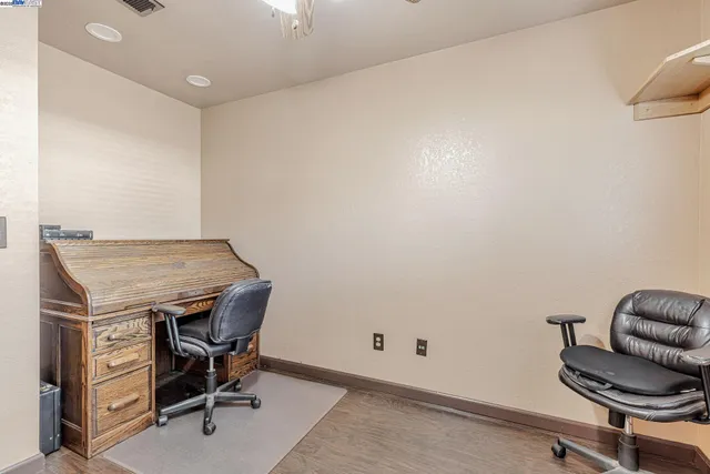 a living room with a chair and couch