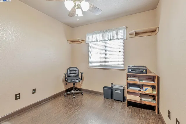 wooden room with furniture and window