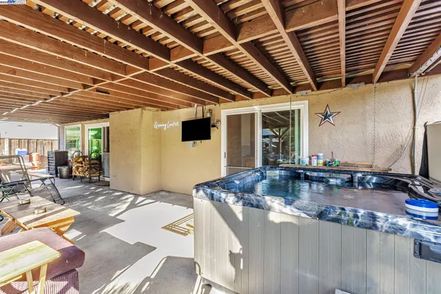 a kitchen with stainless steel appliances granite countertop a sink a stove and a wooden cabinets