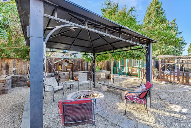 an outdoor space with furniture and umbrella