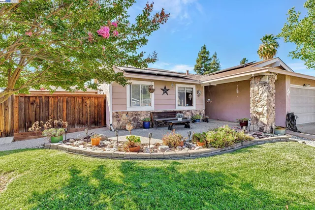 a front view of house with yard and seating area