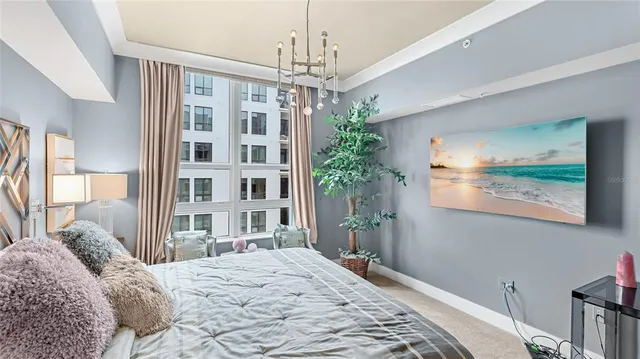 a bedroom with bed and a window