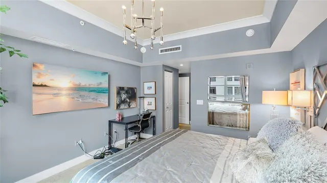 a view of a livingroom with furniture and a chandelier