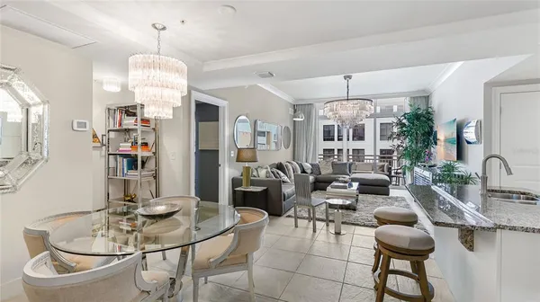 a very nice looking dining room with a table and chairs