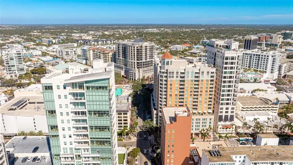 an aerial view of city and ocean