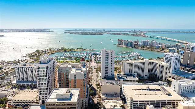 a view of city with ocean
