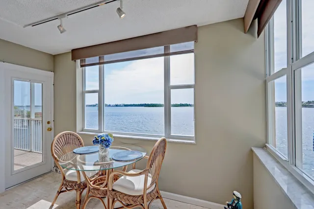 a view of a dining room with furniture window and outside view