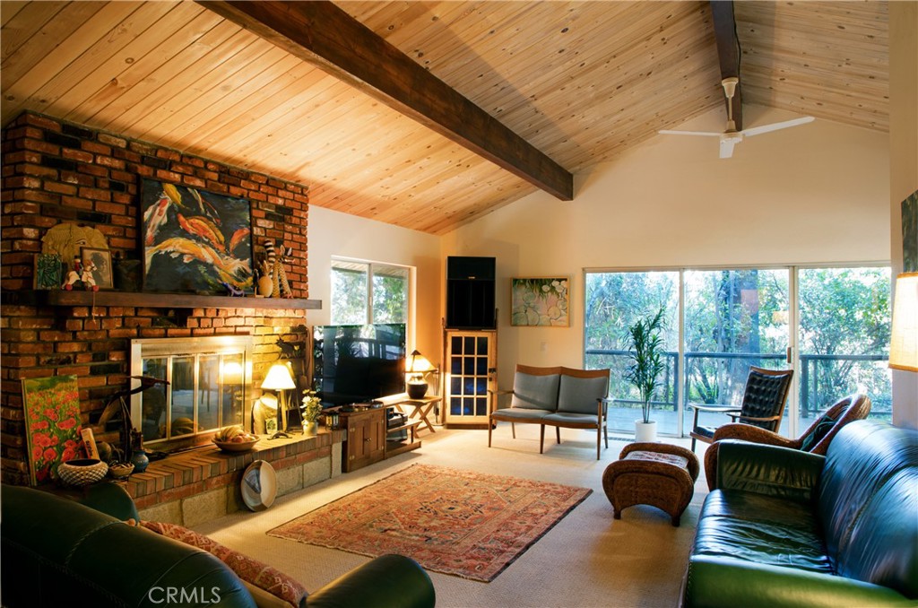 2700 Mill Creek Road Mentone, CA 92359 - Photo 5 of 22 a living room with furniture and a floor to ceiling window