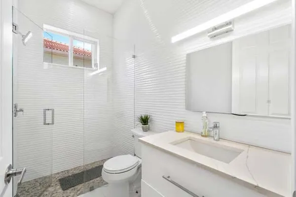 an aerial view of residential houses with lake view