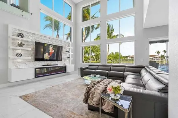 a living room with furniture and a flat screen tv