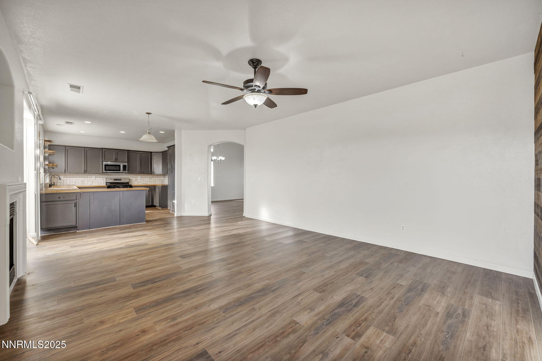 119 Red Oak Court Fernley, NV 89408 - Photo 13 of 64 a view of kitchen with granite countertop cabinets and wooden floor