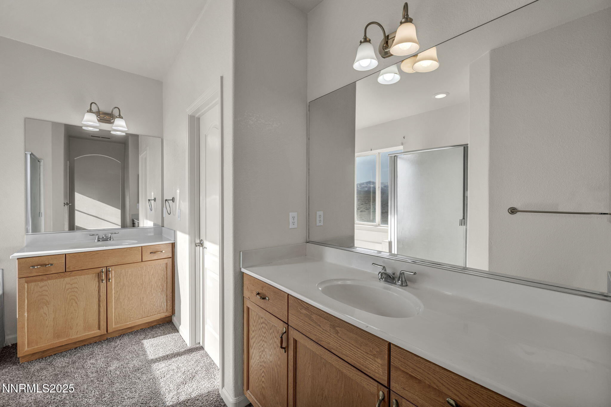 119 Red Oak Court Fernley, NV 89408 - Photo 26 of 64 a bathroom with a double vanity sink and a mirror