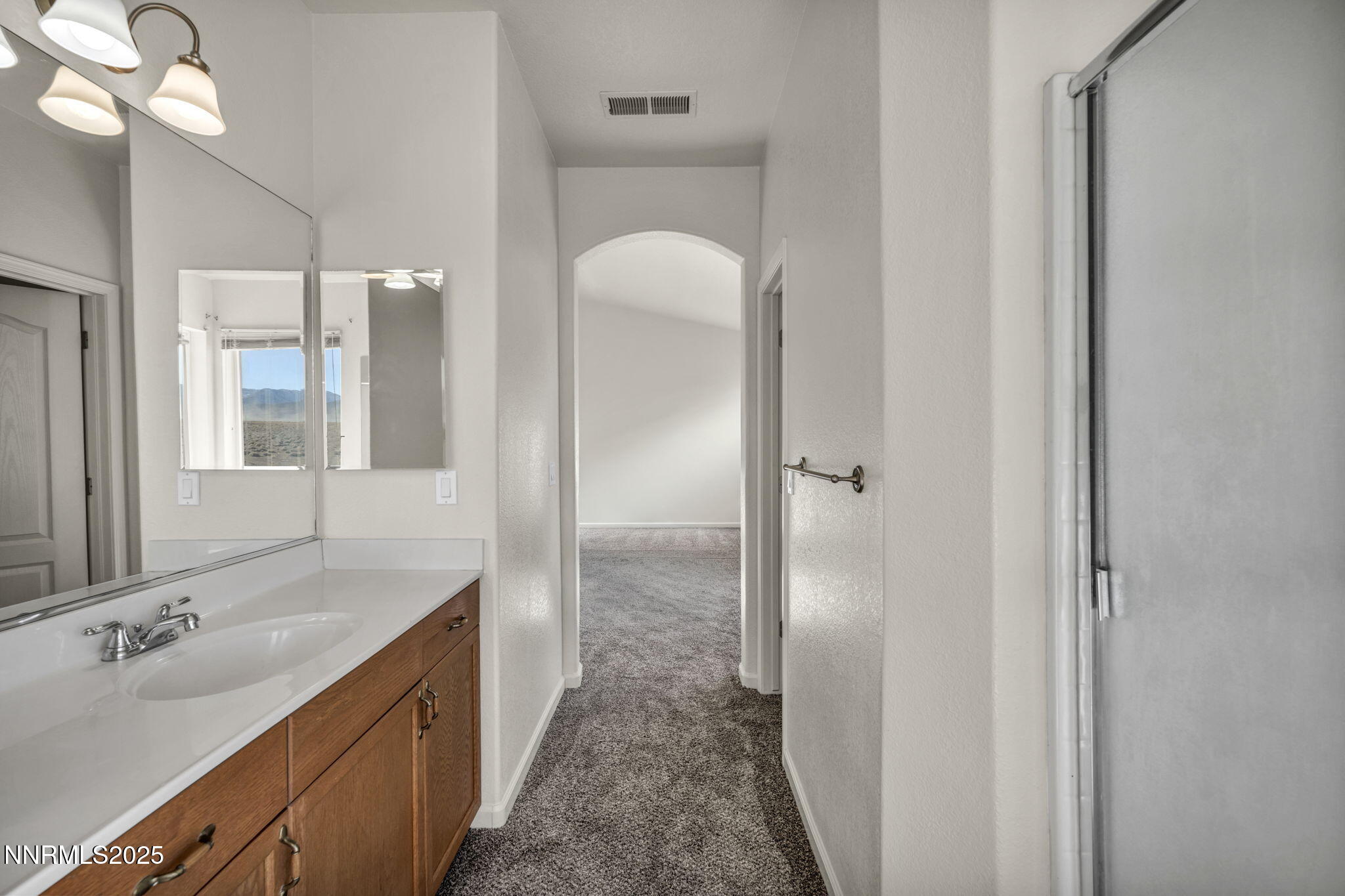 119 Red Oak Court Fernley, NV 89408 - Photo 27 of 64 a bathroom with a sink and a mirror