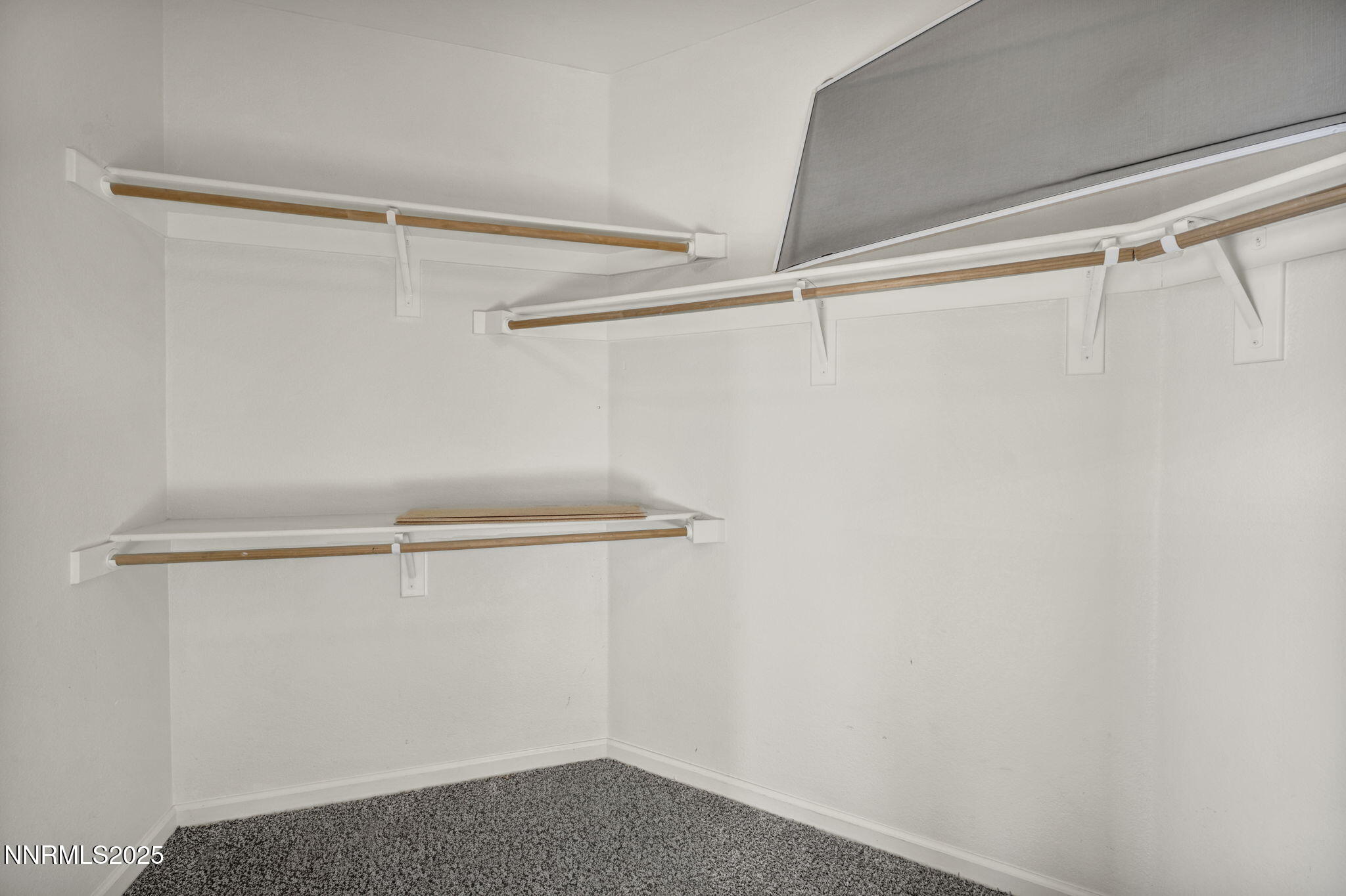 119 Red Oak Court Fernley, NV 89408 - Photo 29 of 64 a view of a room with racks on the wall