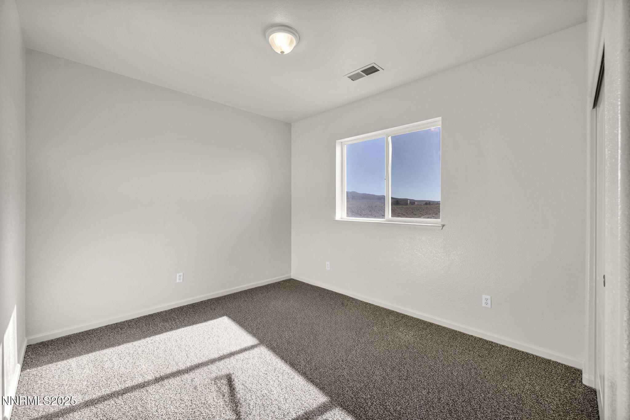 119 Red Oak Court Fernley, NV 89408 - Photo 32 of 64 an empty room with a workspace