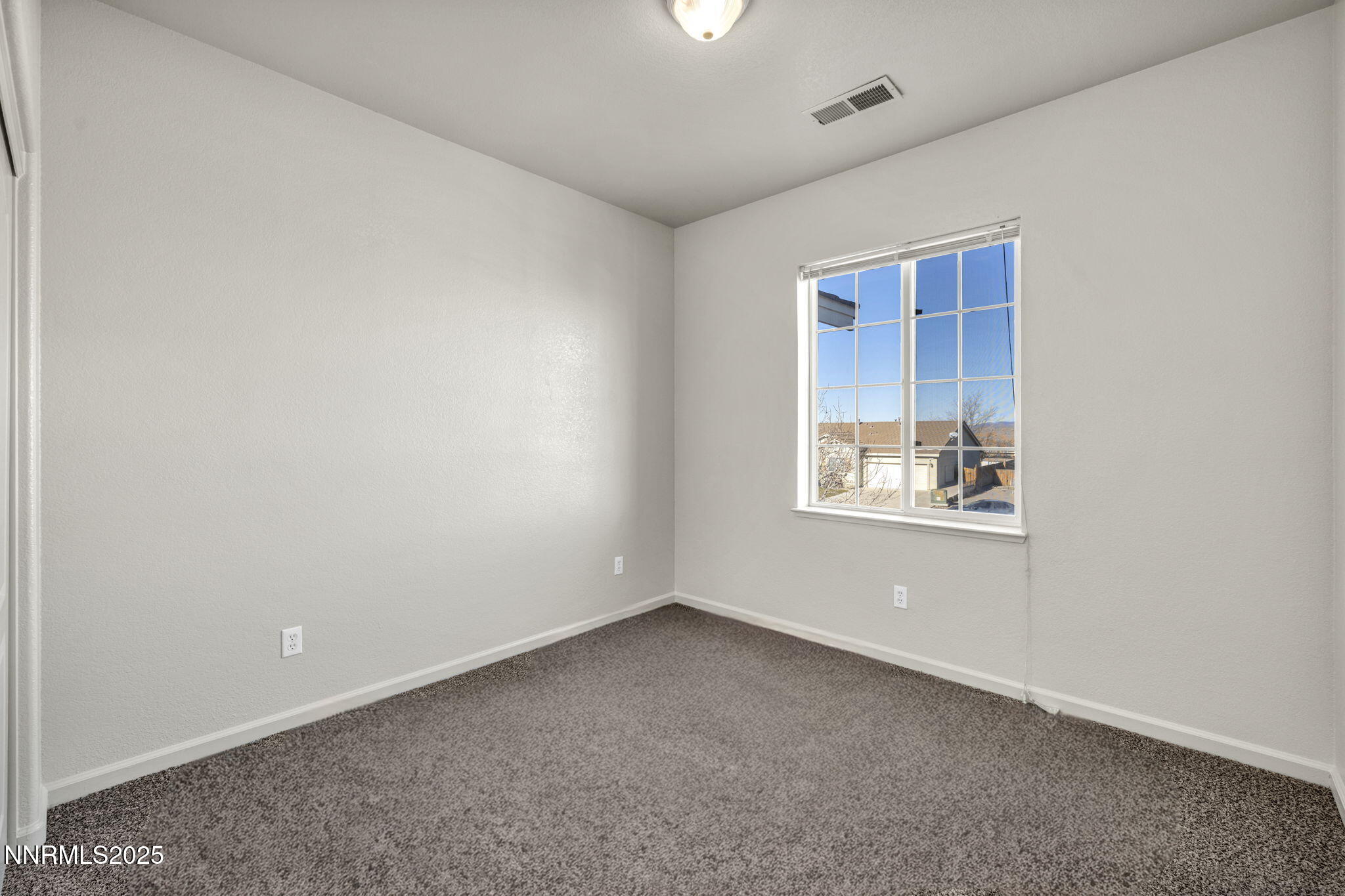 119 Red Oak Court Fernley, NV 89408 - Photo 35 of 64 an empty room with windows