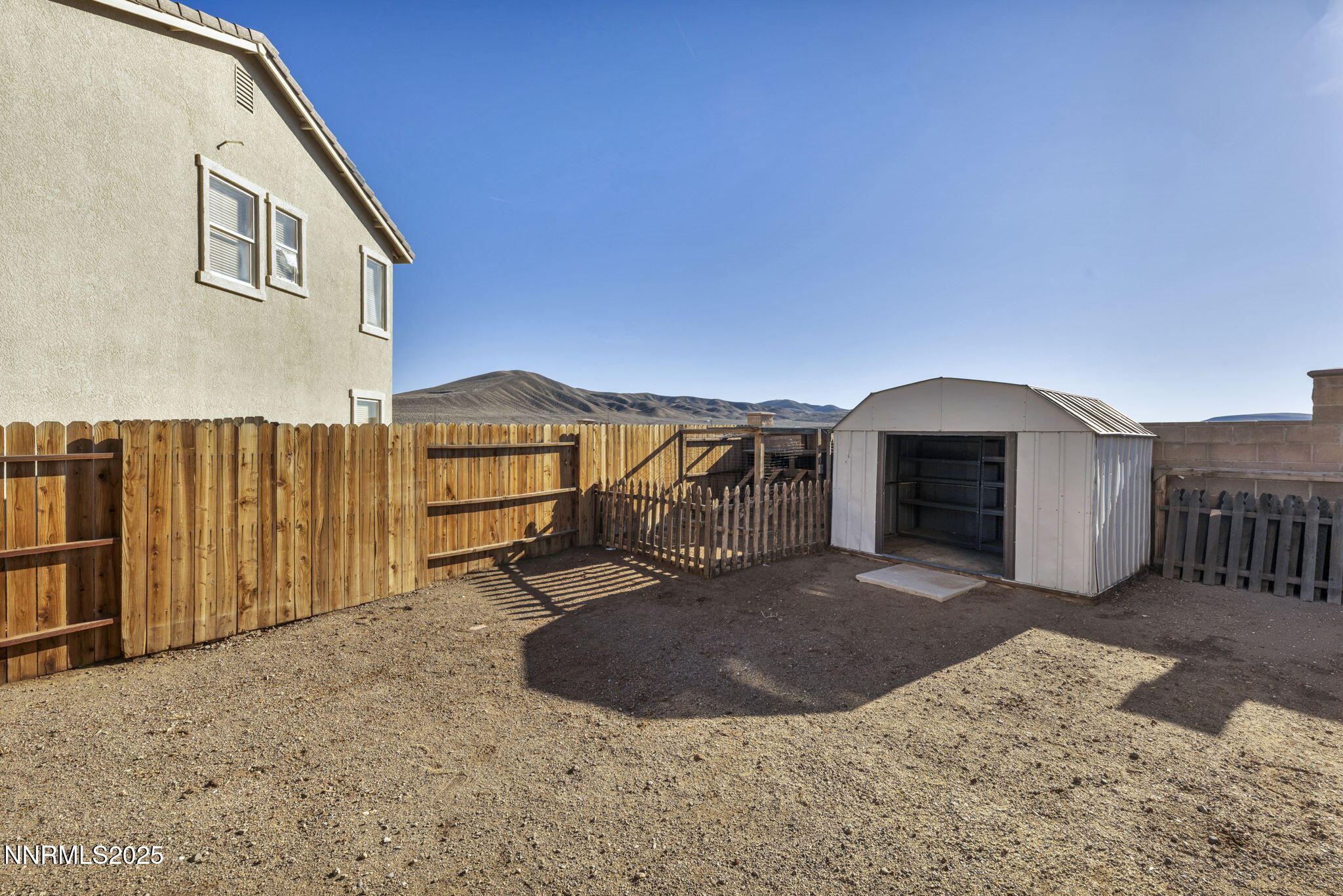 119 Red Oak Court Fernley, NV 89408 - Photo 45 of 64 a view of a house with a snow in the yard