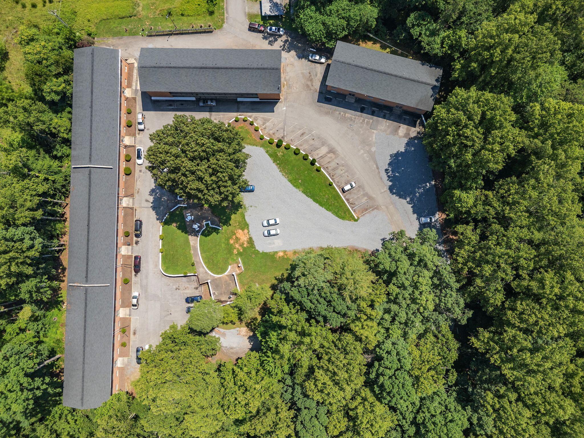 100 Ridgeview Lane, Unit 30 Bassett, VA 24055 - Photo 20 of 22 an aerial view of a house with a yard and garden
