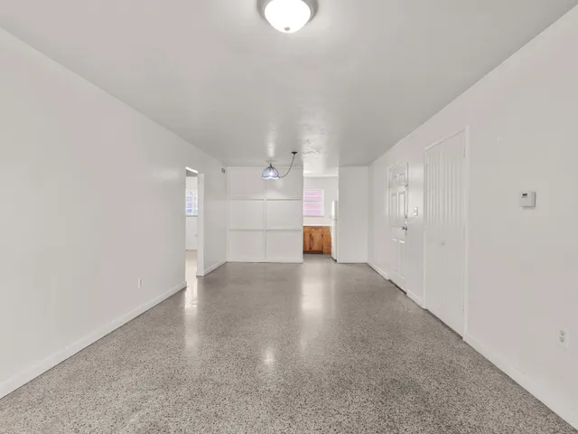 a view of a kitchen with a sink and a window