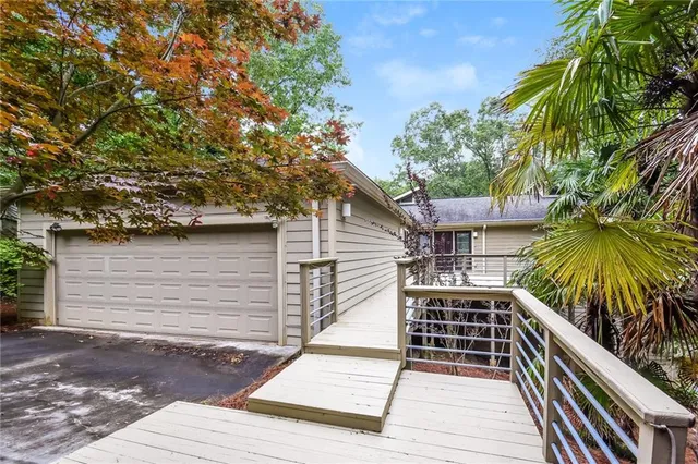 a view of a house with a tree