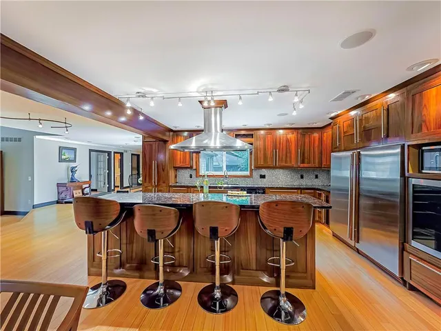 a dining room with furniture and chandelier