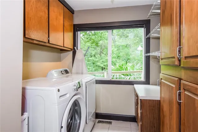 a view of a kitchen with washer and dryer