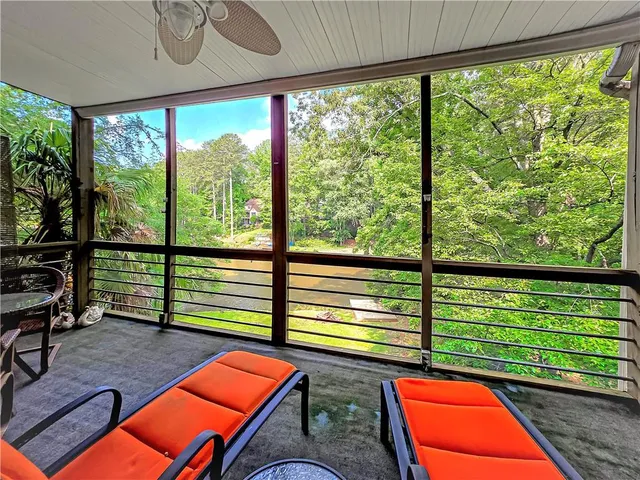 a room with furniture and a large window