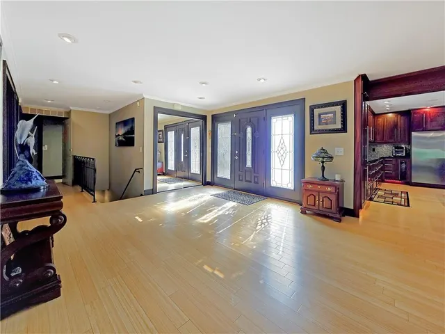 a view of a livingroom with furniture and hardwood