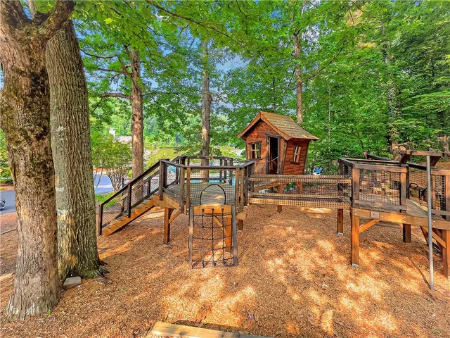 a view of a chairs and table in the patio