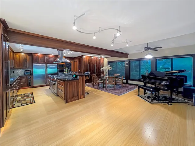 a room with lots of furniture and a large window