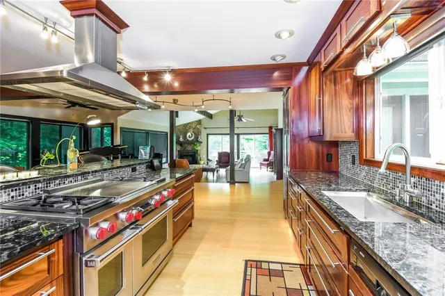 a kitchen with stainless steel appliances granite countertop a sink and counter space