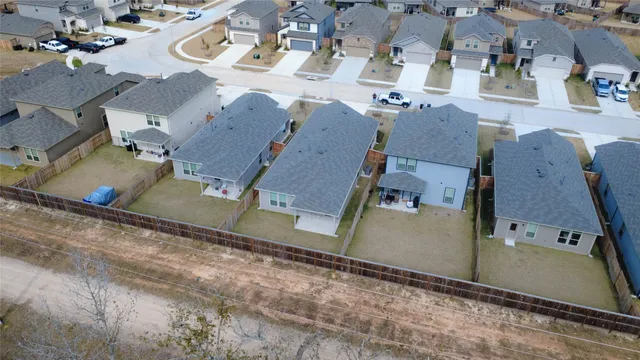 an aerial view of residential houses with outdoor space
