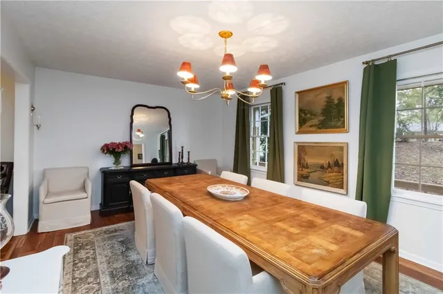 a dining room with a table and chairs