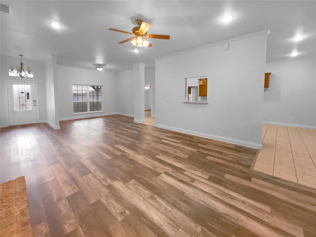 3915 Tower Circle Nevada, TX 75173 - Photo 11 of 29 an empty room with wooden floor and windows