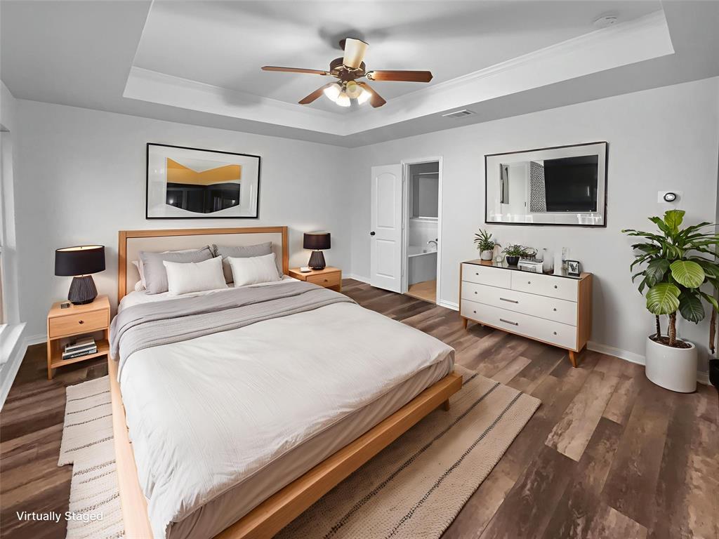 3915 Tower Circle Nevada, TX 75173 - Photo 12 of 29 a spacious bedroom with a bed and a potted plant