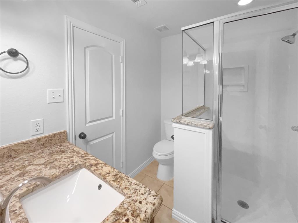 3915 Tower Circle Nevada, TX 75173 - Photo 22 of 29 a bathroom with a sink toilet and shower