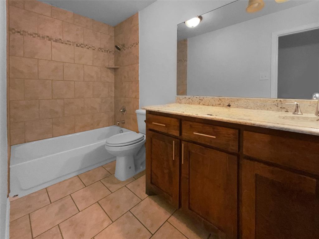 3915 Tower Circle Nevada, TX 75173 - Photo 25 of 29 a bathroom with a sink a toilet and shower