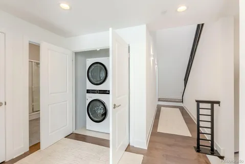 a view of an entryway with wooden floor