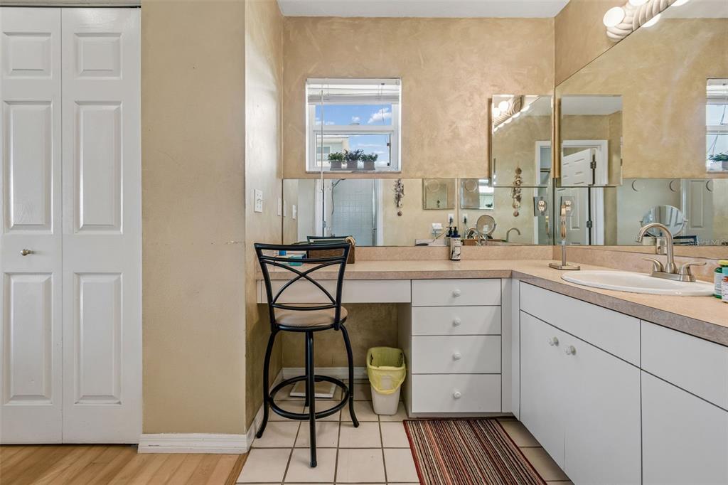 119 Burns Road Terra Ceia, FL 34250 - Photo 44 of 100 a spacious bathroom with a double vanity sink a mirror and a shower
