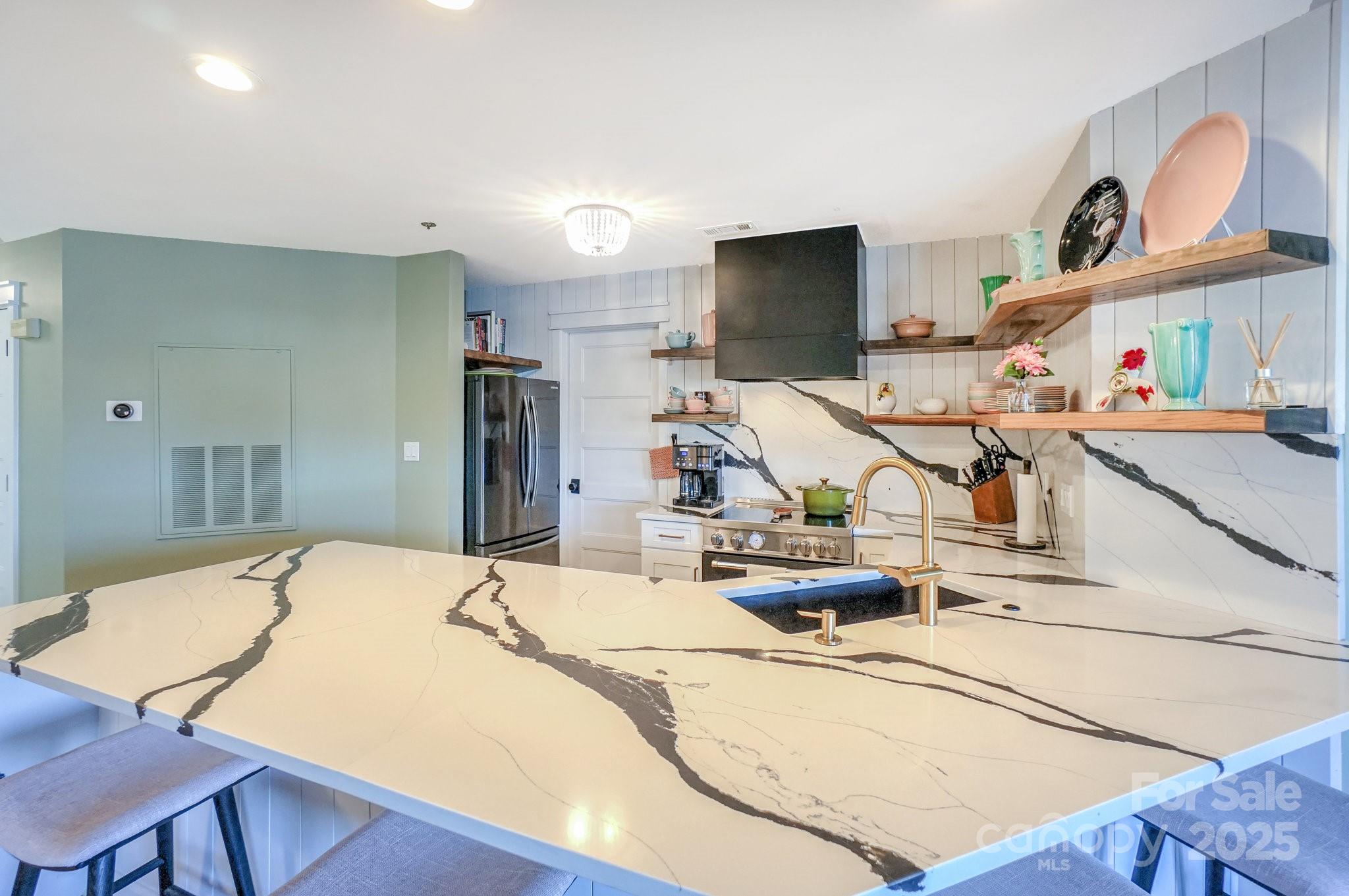 18631 Vineyard Point Lane Cornelius, NC 28031 - Photo 15 of 43 a room with a table chairs and a kitchen view