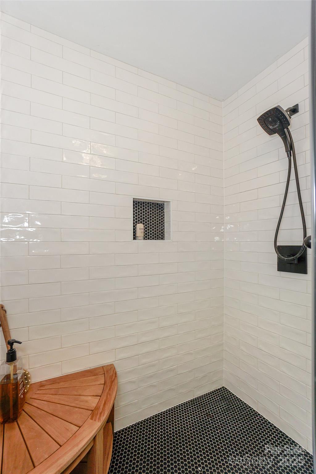 18631 Vineyard Point Lane Cornelius, NC 28031 - Photo 25 of 43 a bathroom with a sink and a shower