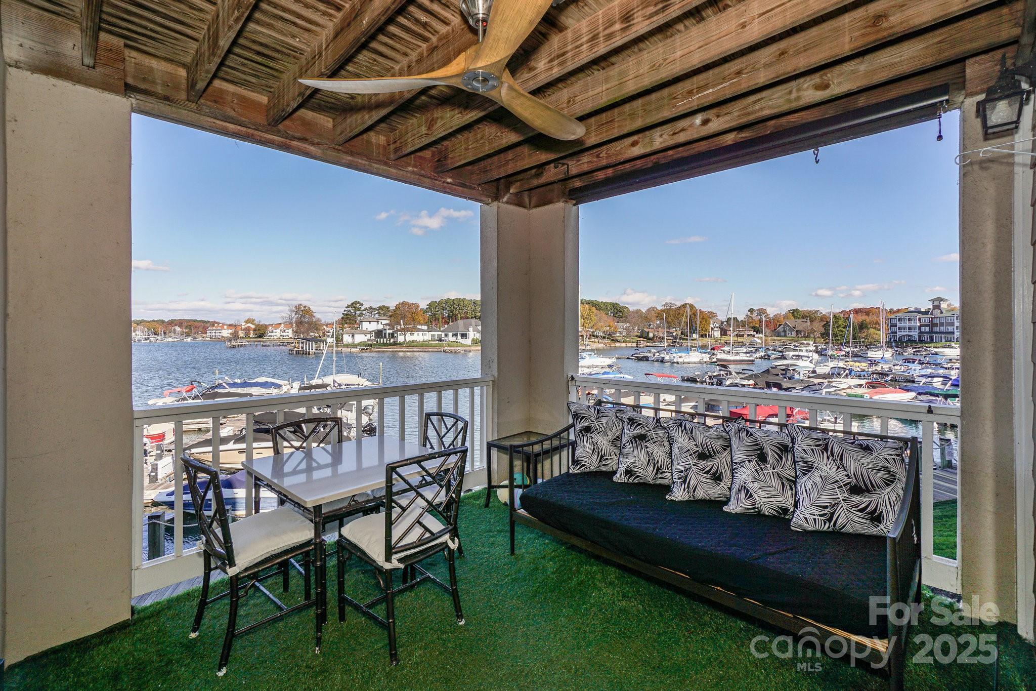 18631 Vineyard Point Lane Cornelius, NC 28031 - Photo 34 of 43 a view of a chairs and table in balcony