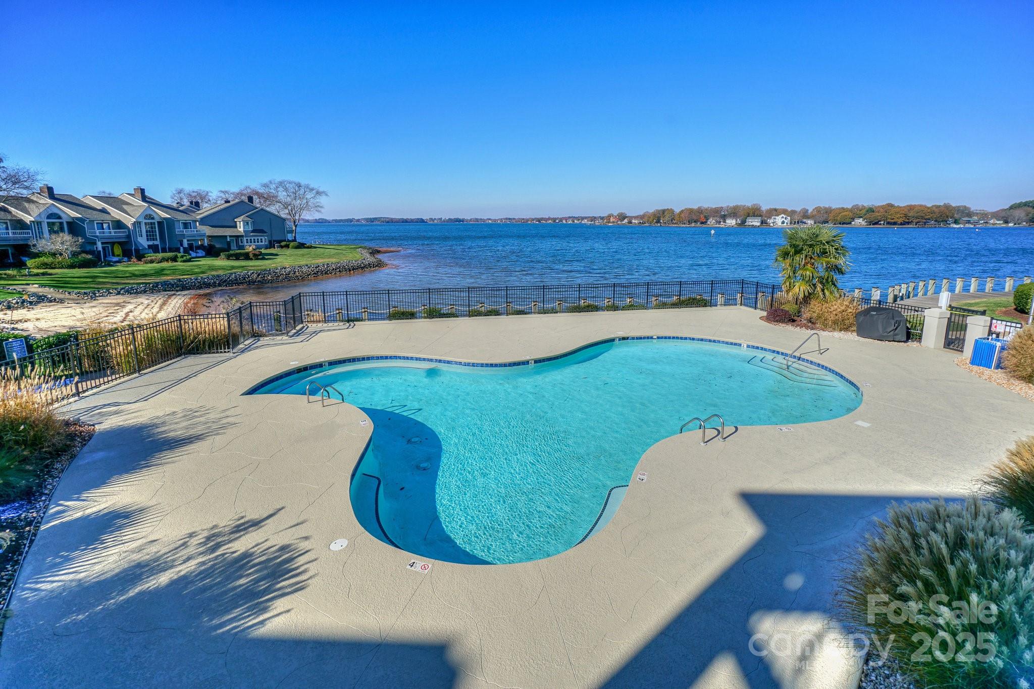 18631 Vineyard Point Lane Cornelius, NC 28031 - Photo 37 of 43 a view of a swimming pool with an outdoor seating