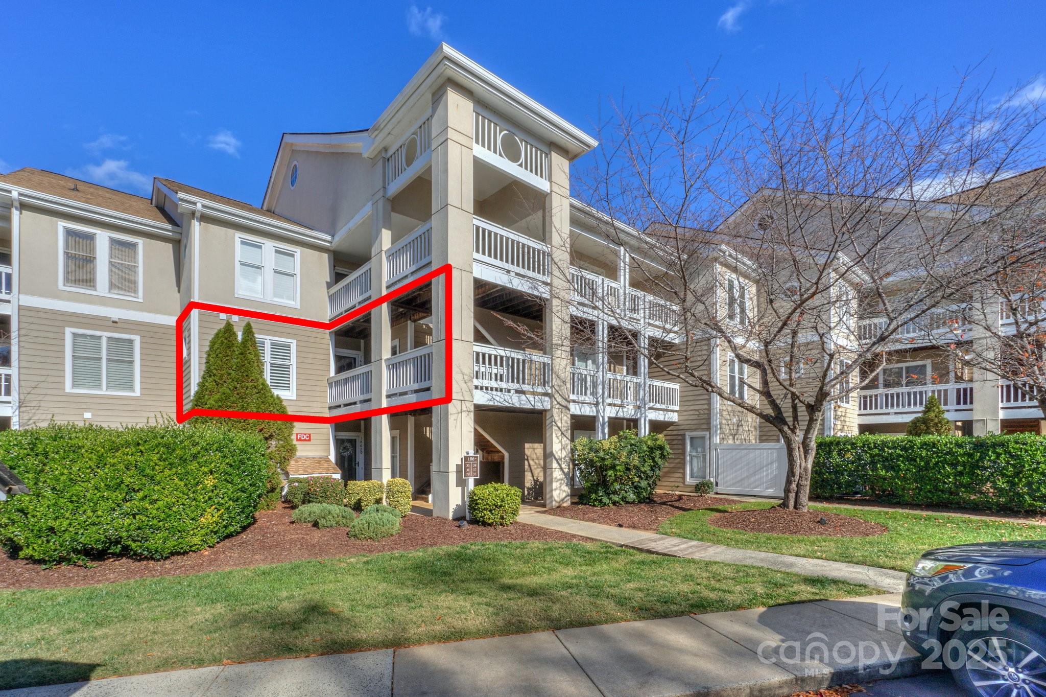 18631 Vineyard Point Lane Cornelius, NC 28031 - Photo 7 of 43 a view of a building with a yard and plants