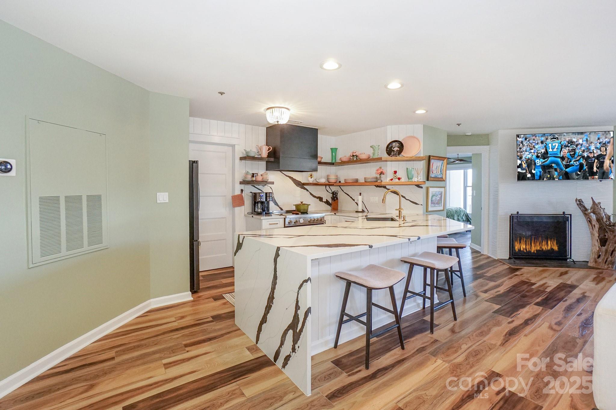 18631 Vineyard Point Lane Cornelius, NC 28031 - Photo 9 of 43 a view of a dining room with furniture and wooden floor