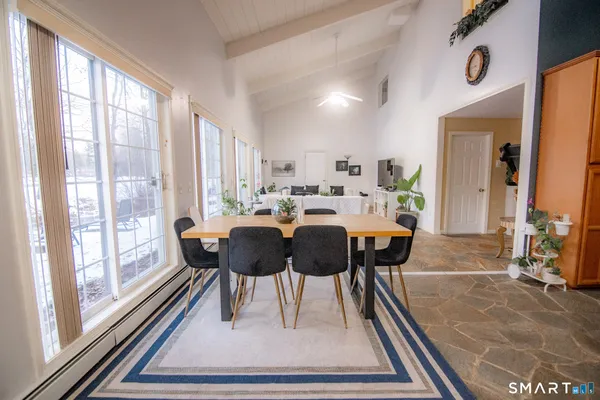 a view of a dining room with furniture window and outside view